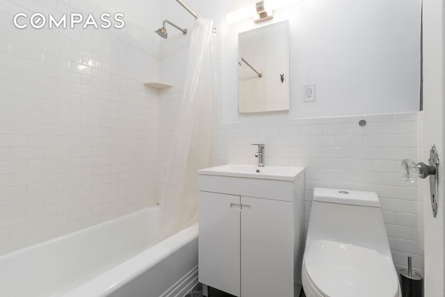 104 E 37th St Unit 5C, New York City, NY 10016 - full bathroom with vanity, shower / bath combination with curtain, tile walls, and toilet