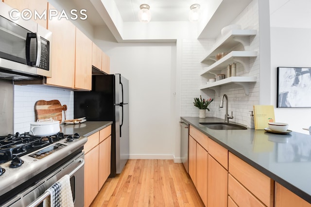 475 Sterling Pl Unit 3A, New York City, NY 11238 - kitchen with appliances with stainless steel finishes, dark countertops, decorative backsplash, open shelves, and light wood-type flooring