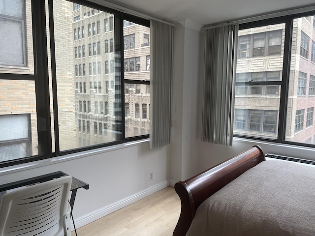 301 E 45th St Unit 10B, New York City, NY 10017 - bedroom with wood finished floors and baseboards