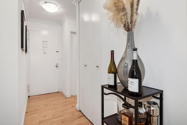 301 E 45th St Unit 10B, New York City, NY 10017 - hallway featuring light wood-style flooring and crown molding