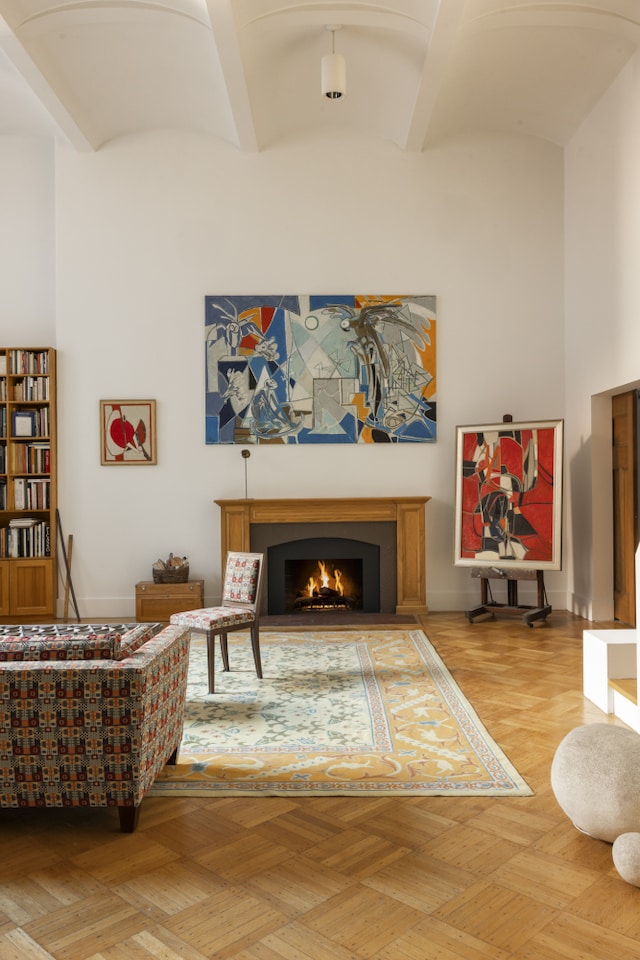 27 W 67th St Unit 2Fe, New York City, NY 10023 - living area with a lit fireplace
