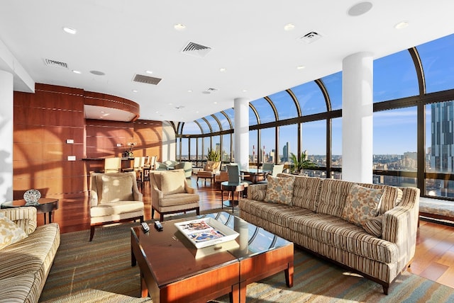 530 E 76th St Unit 20B, New York City, NY 10021 - living area with wood finished floors, expansive windows, and recessed lighting
