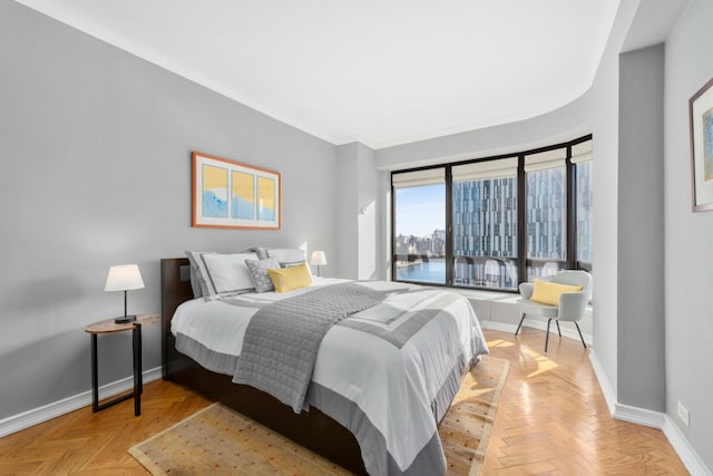 530 E 76th St Unit 20B, New York City, NY 10021 - bedroom featuring baseboards and crown molding