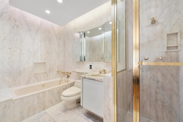 530 E 76th St Unit 20B, New York City, NY 10021 - full bathroom with vanity, a garden tub, toilet, tile walls, and marble finish floors