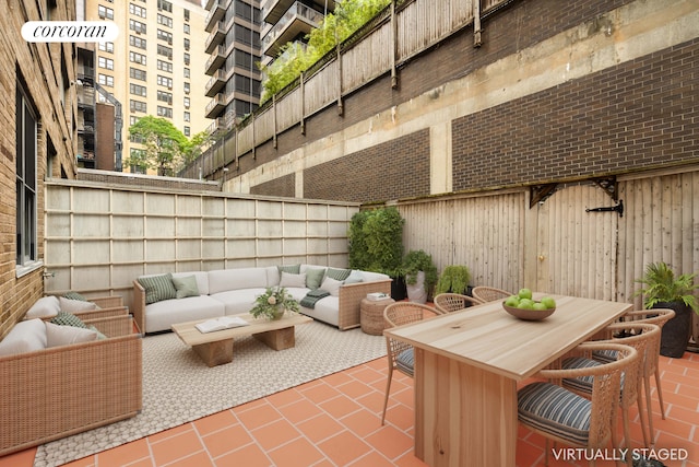 330 E 49th St Unit 1A, New York City, NY 10017 - fenced backyard with an outdoor hangout area, a patio area, and outdoor dining area