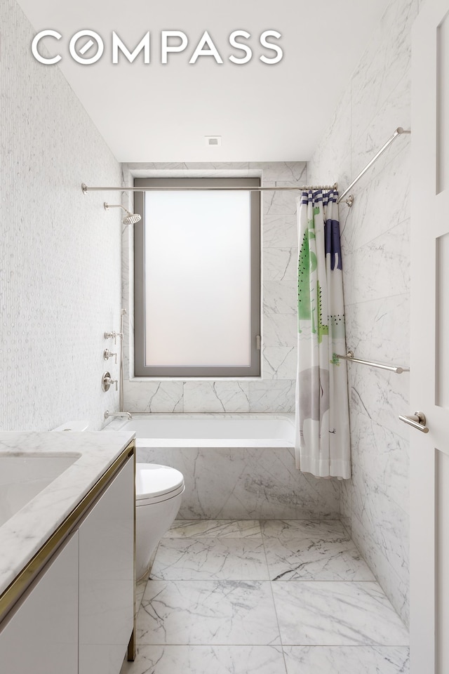 116 University Pl Unit 5, New York City, NY 10003 - bathroom with tiled shower / bath, vanity, toilet, and marble look tiles