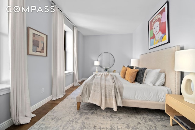 225 5th Ave Unit 7K, New York City, NY 10010 - bedroom featuring dark wood-style floors and baseboards