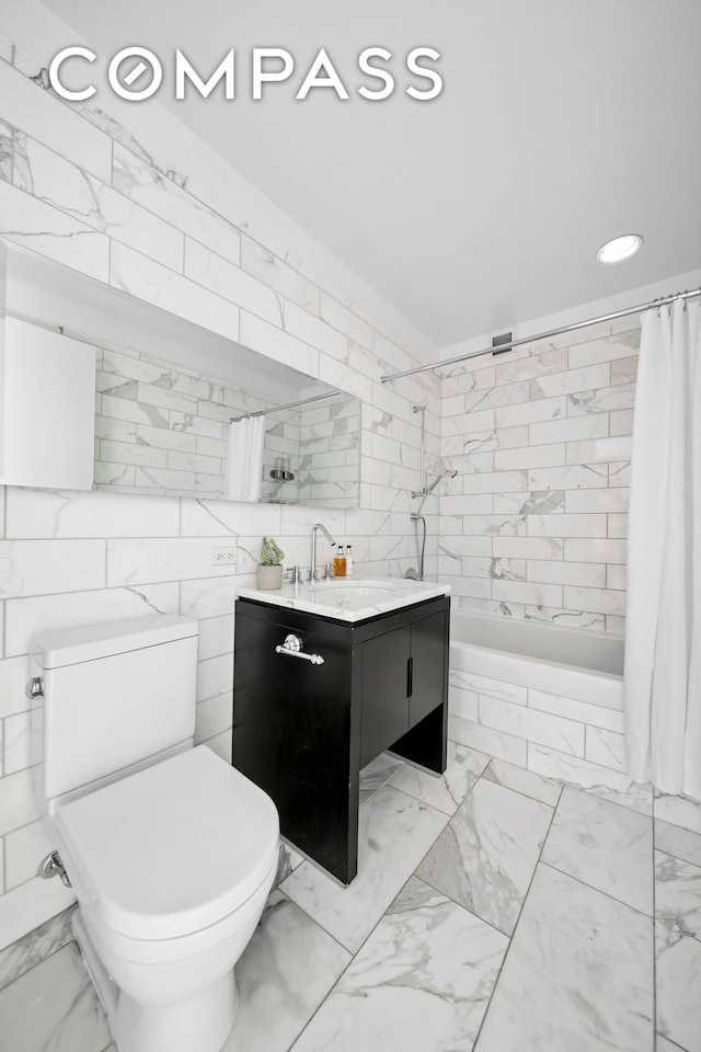 225 5th Ave Unit 7K, New York City, NY 10010 - full bath with marble finish floors, vanity, tile walls, toilet, and tiled shower / bath