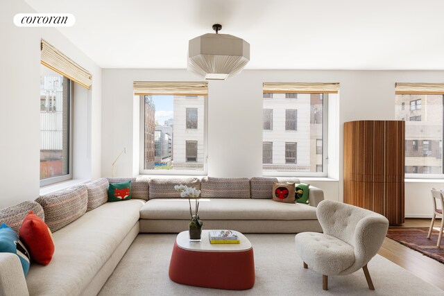 116 University Pl Unit 5Th, New York City, NY 10003 - living area featuring healthy amount of natural light and wood finished floors