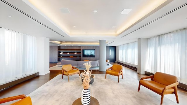 202 Broome St Unit 9M, New York City, NY 10013 - living area featuring a raised ceiling and wood finished floors