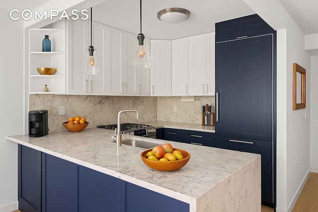1325 5th Ave Unit 3K, New York City, NY 10029 - kitchen with open shelves, white cabinetry, tasteful backsplash, a peninsula, and decorative light fixtures