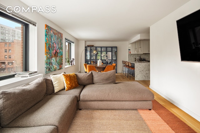 1325 5th Ave Unit 3K, New York City, NY 10029 - living area featuring wood finished floors and baseboards