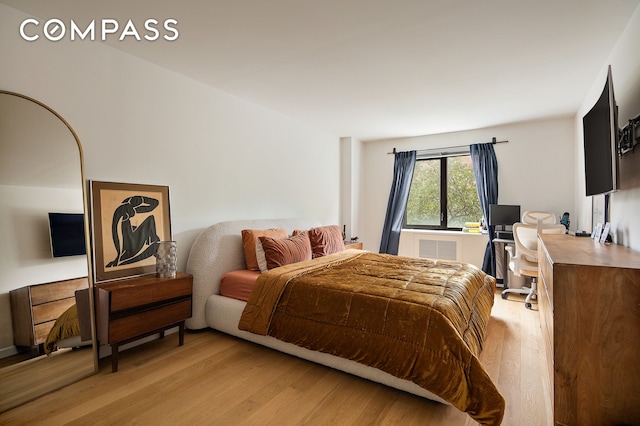 1325 5th Ave Unit 3K, New York City, NY 10029 - bedroom featuring light wood finished floors and an office area