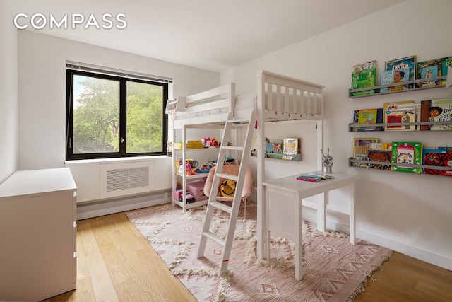 1325 5th Ave Unit 3K, New York City, NY 10029 - bedroom featuring wood finished floors