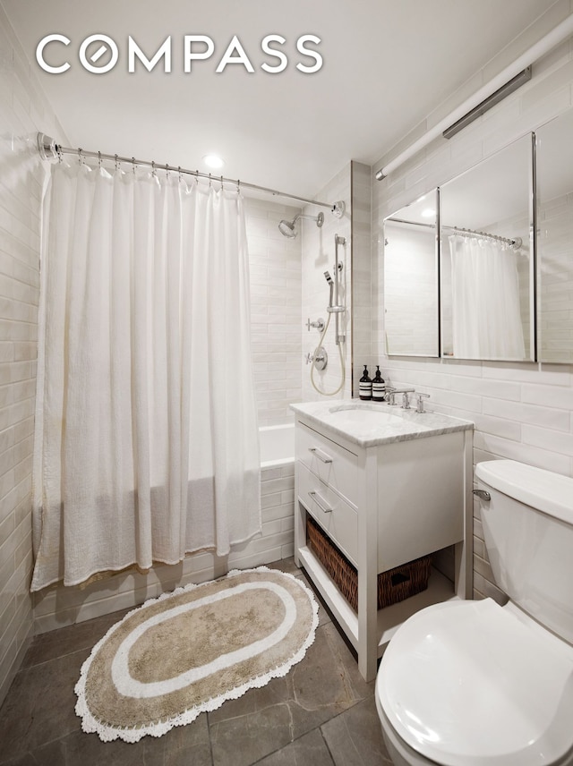 1325 5th Ave Unit 3K, New York City, NY 10029 - full bathroom with tiled shower / bath, vanity, and tile walls