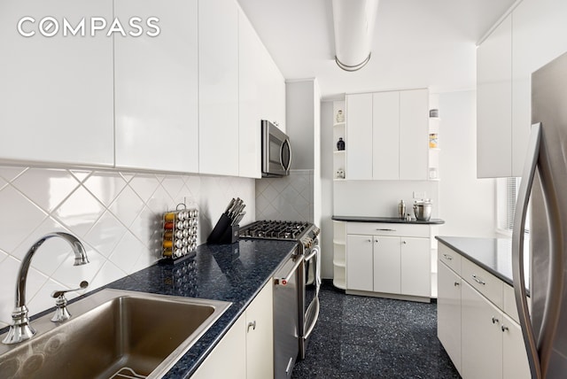 444 E 86th St Unit 11H, New York City, NY 10028 - kitchen featuring stainless steel appliances, open shelves, dark countertops, white cabinets, and tasteful backsplash