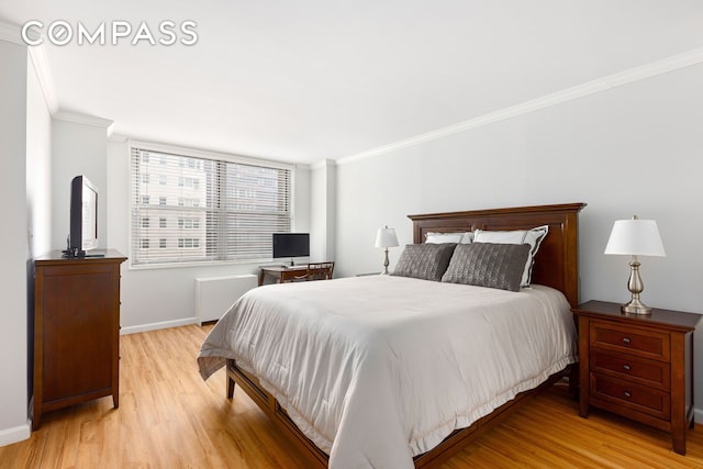 444 E 86th St Unit 11H, New York City, NY 10028 - bedroom with crown molding, light wood-style floors, and radiator