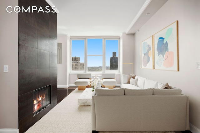 404 E 76th St Unit 30A, New York City, NY 10021 - living area with dark wood finished floors, a tile fireplace, and baseboards