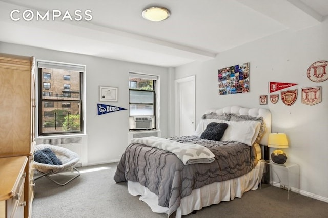 235 E 73rd St Unit 12C, New York City, NY 10021 - bedroom with radiator, carpet flooring, baseboards, and beamed ceiling
