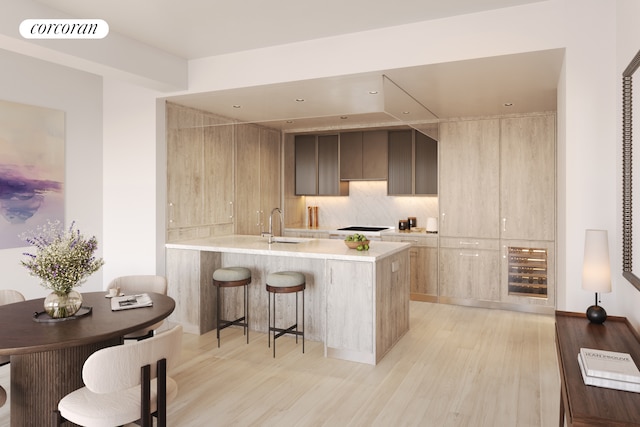 720 W End Ave Unit 8J, New York City, NY 10025 - kitchen with light countertops, a peninsula, light wood-type flooring, a breakfast bar area, and modern cabinets