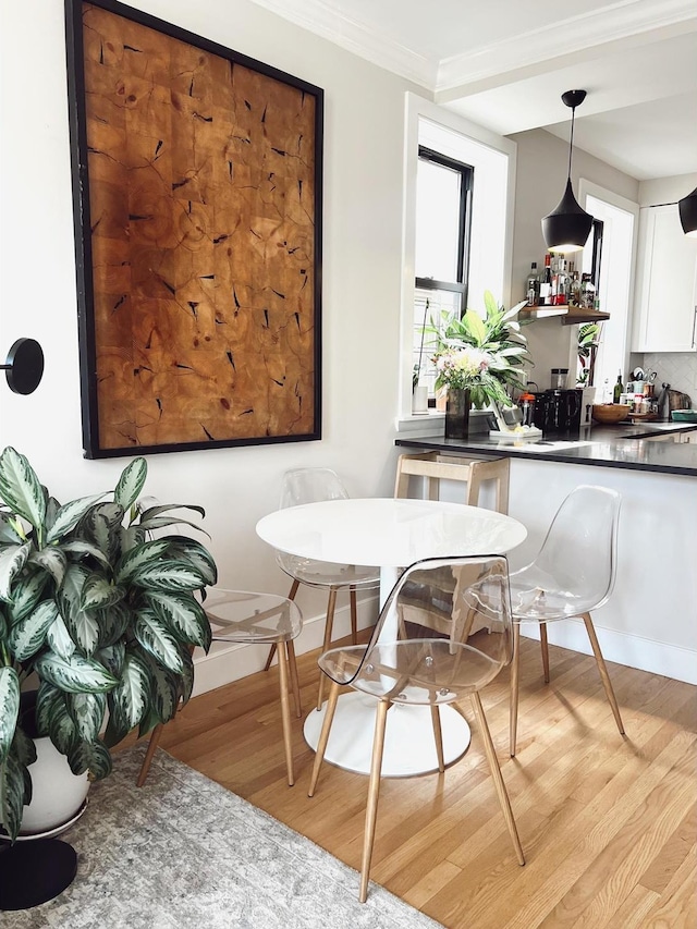 1890 Adam C Powell Blvd Unit 5C, New York City, NY 10026 - dining room with light wood-type flooring and crown molding