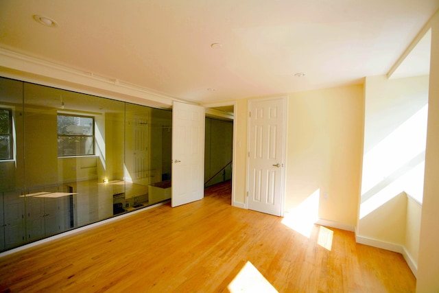 259 21st St Unit 1C, New York City, NY 11215 - spare room with wood finished floors and baseboards