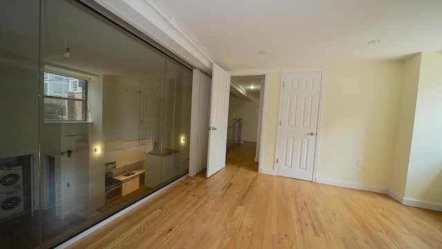 259 21st St Unit 1C, New York City, NY 11215 - unfurnished bedroom with light wood-style flooring and baseboards