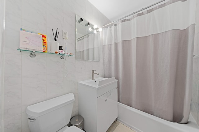 330 E 33rd St Unit 7B, New York City, NY 10016 - full bath featuring tile walls, vanity, shower / bath combo with shower curtain, and toilet