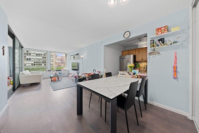 330 E 33rd St Unit 7B, New York City, NY 10016 - dining space with dark wood finished floors, baseboards, and a view of city