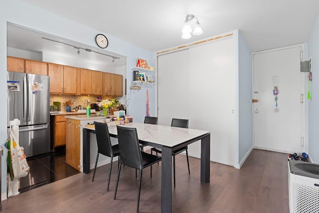 330 E 33rd St Unit 7B, New York City, NY 10016 - dining space with dark wood-style floors and track lighting