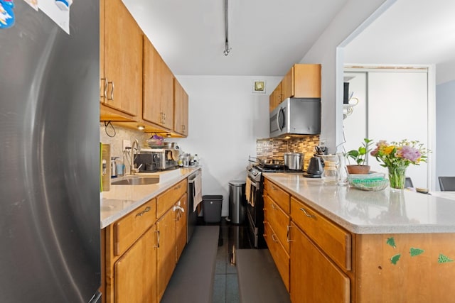 330 E 33rd St Unit 7B, New York City, NY 10016 - kitchen with appliances with stainless steel finishes, decorative backsplash, brown cabinetry, and a peninsula