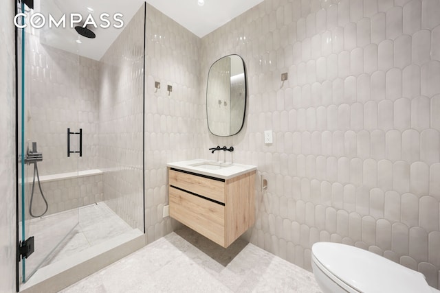 176 W 87th St Unit 1H, New York City, NY 10024 - full bath with tile walls, vanity, a tile shower, toilet, and tile patterned floors
