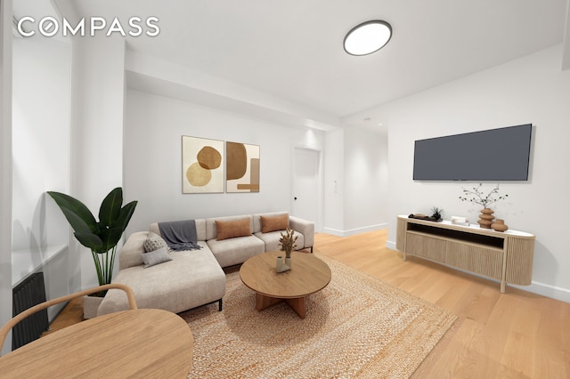176 W 87th St Unit 1H, New York City, NY 10024 - living room featuring light wood-style flooring and baseboards