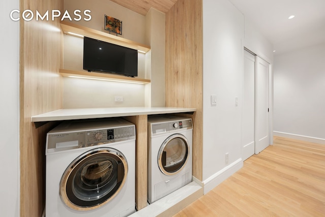 176 W 87th St Unit 1H, New York City, NY 10024 - laundry area with washer and dryer, wood finished floors, baseboards, and recessed lighting