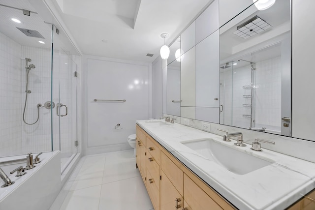 21 E 61st St Unit 9D, New York City, NY 10065 - full bathroom featuring a stall shower, double vanity, toilet, and tile patterned flooring