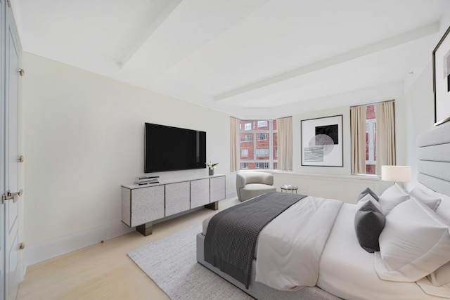 21 E 61st St Unit 9D, New York City, NY 10065 - bedroom featuring baseboards and light wood-style flooring