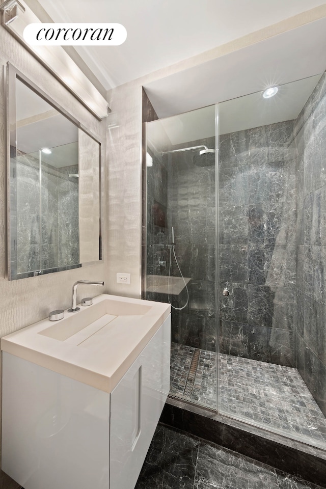 408 E 79th St Unit 9A, New York City, NY 10075 - full bathroom featuring marble finish flooring, a shower stall, vanity, and recessed lighting