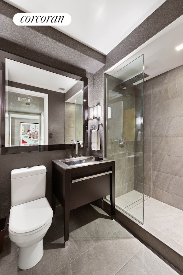 408 E 79th St Unit 9A, New York City, NY 10075 - bathroom featuring walk in shower, vanity, and tile patterned flooring