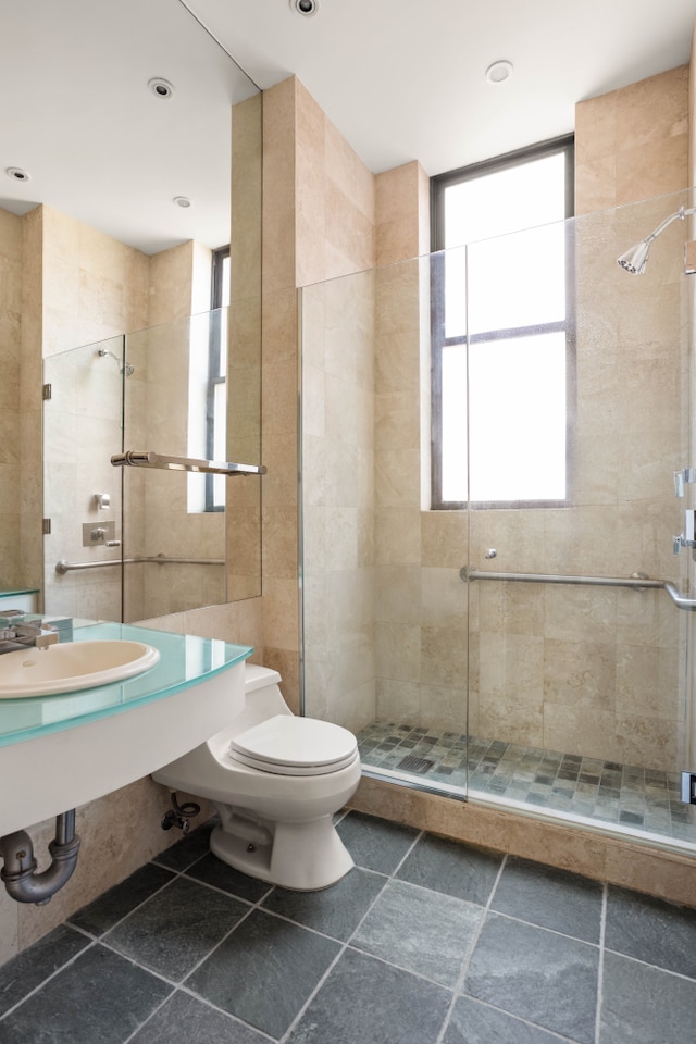 27 W 67th St Unit 8Rew, New York City, NY 10023 - bathroom featuring toilet, a shower stall, and a sink
