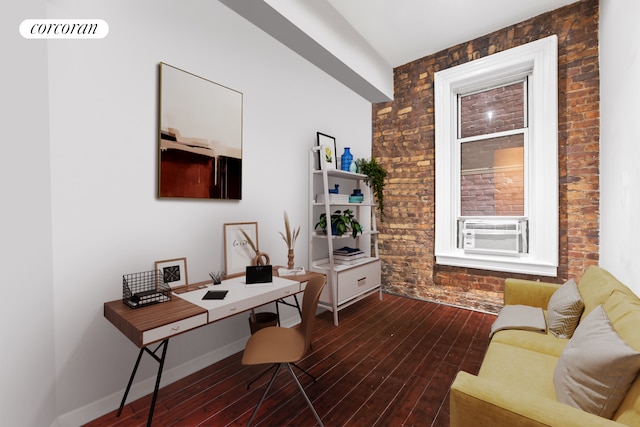 324 E 50th St Unit 4D, New York City, NY 10022 - office featuring brick wall, cooling unit, wood finished floors, and an accent wall