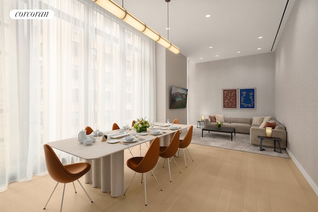 430 E 58th St Unit 65A, New York City, NY 10022 - dining area with wood finished floors, recessed lighting, and baseboards