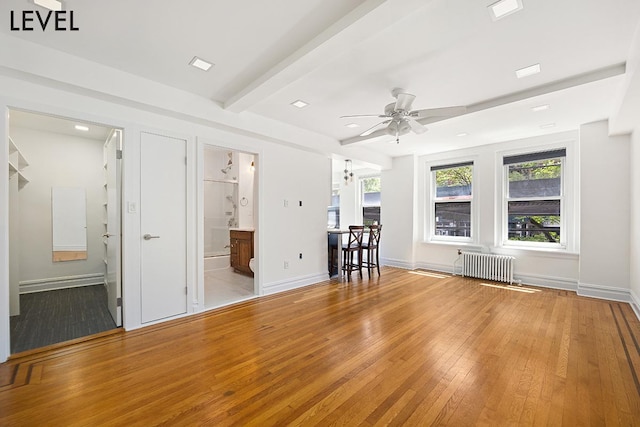 200 W 108th St Unit 2-E, New York City, NY 10025 - living area featuring radiator, hardwood / wood-style floors, ceiling fan, baseboards, and beam ceiling