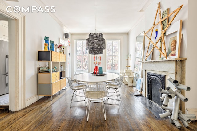 294 Hicks St Unit 2, New York City, NY 11201 - dining area with dark wood finished floors, ornamental molding, and a fireplace