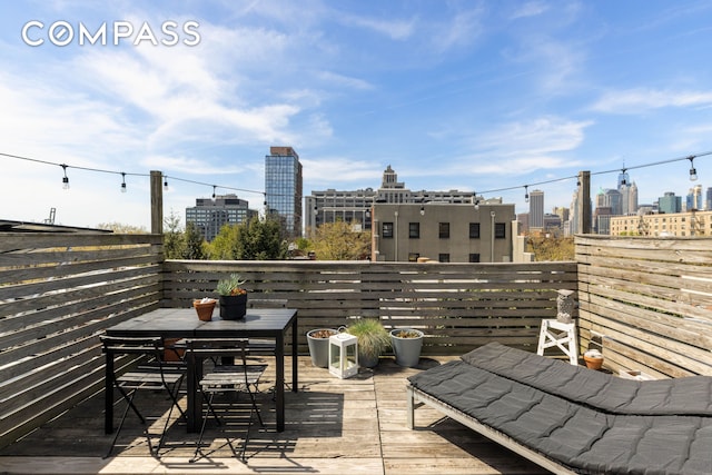 294 Hicks St Unit 2, New York City, NY 11201 - balcony featuring a view of skyline and outdoor dining space