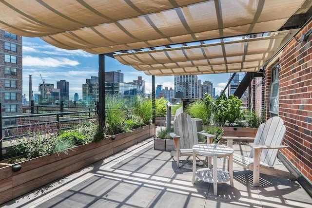 239 E 79th St Unit 12A, New York City, NY 10075 - view of patio / terrace with a skyline view and a pergola