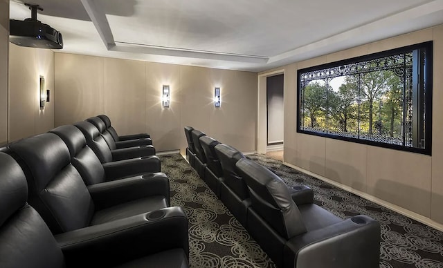 344 W 72nd St Unit 203, New York City, NY 10023 - carpeted cinema room with a raised ceiling and baseboards