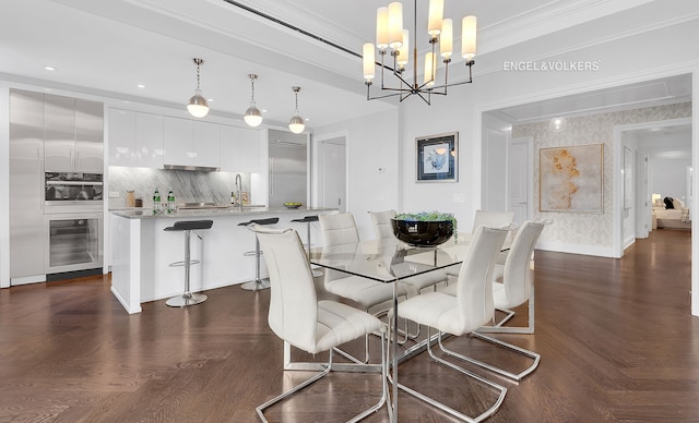 344 W 72nd St Unit 203, New York City, NY 10023 - dining area featuring beverage cooler, a chandelier, and ornamental molding