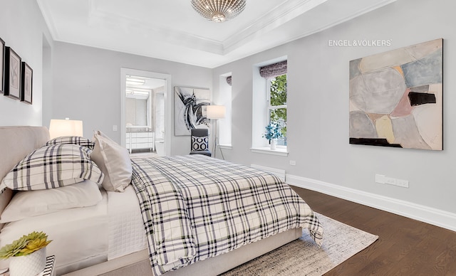 344 W 72nd St Unit 203, New York City, NY 10023 - bedroom with wood finished floors, a tray ceiling, ornamental molding, and connected bathroom