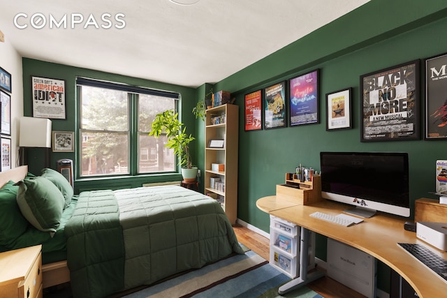 495 E 7th St Unit 2F, New York City, NY 11218 - bedroom featuring wood finished floors and a desk