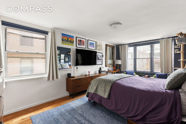 495 E 7th St Unit 2F, New York City, NY 11218 - bedroom featuring wood finished floors and baseboards